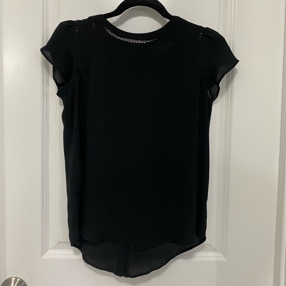 Black Crepe Sleeveless Blouse with Shoulder ruffle and Eyelet Detailing